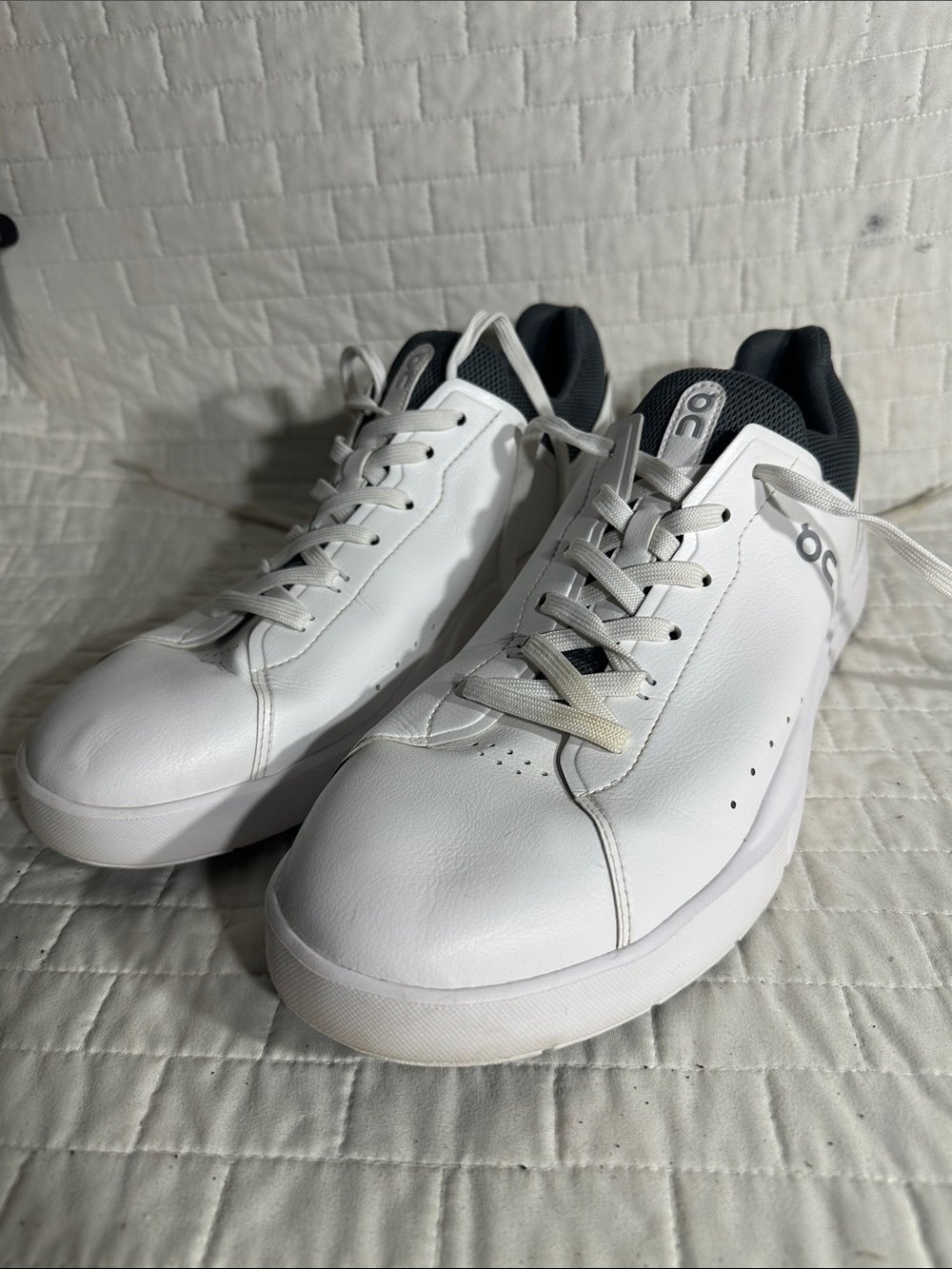 On Running The Roger Advantage Men’s White Sneakers with Black Accents